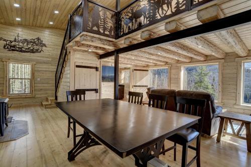 a dining room with a table and chairs at Amethyst Hideaway in Creede