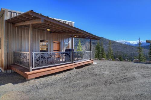 a small house with a balcony on a lot at Amethyst Hideaway in Creede