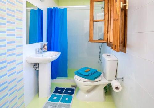 a bathroom with a toilet and a sink at Art house old town in Rhodes Town