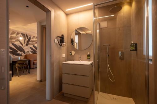 a bathroom with a sink and a shower at Residence Paradise in Riva del Garda