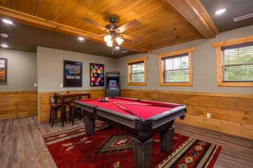 a pool table in a room with a ceiling at Mountain Palace by Eden Crest in Gatlinburg