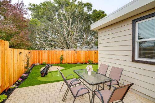 a patio with a table and chairs and a fence at Del Rey Oaks Vacation Home with Mini-Golf Course! in Del Rey Oaks