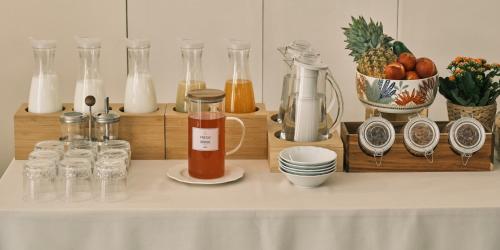 a table with a counter top with bottles and jars at Cifilì House of Charme in Catania