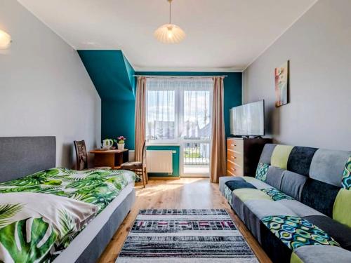 Postel nebo postele na pokoji v ubytování Willa Adek Władysławowo