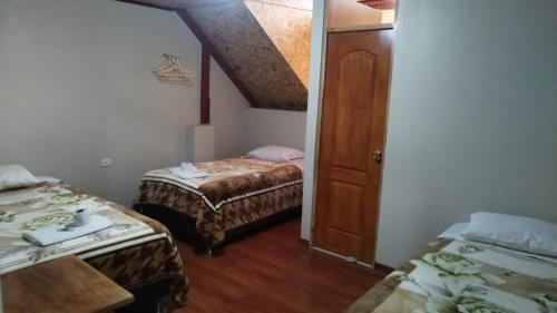 Postel nebo postele na pokoji v ubytování Hospedaje Chonta Lily