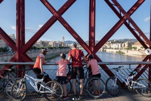 a group of people standing on a bridge at Masia Bernat in Tortosa