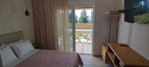 Ένα ή περισσότερα κρεβάτια σε δωμάτιο στο Zephyros Villas - Agios Nikitas