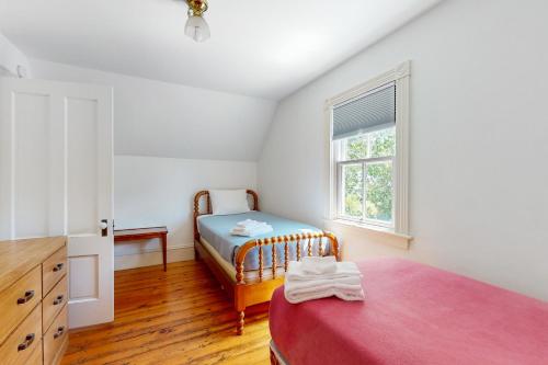 a bedroom with a bed and a window at Parker House in Camden