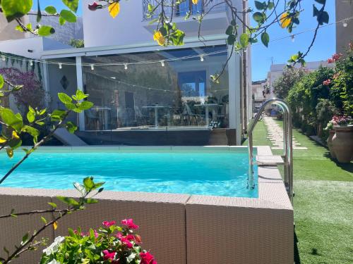 a swimming pool in the backyard of a house at Ricordi Siciliani - Charme Rooms in San Vito lo Capo