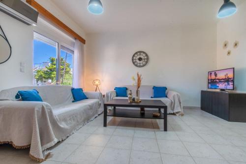 a living room with a couch and a table at Mike's House in Kremasti near the Beach Rhodes in Kremasti