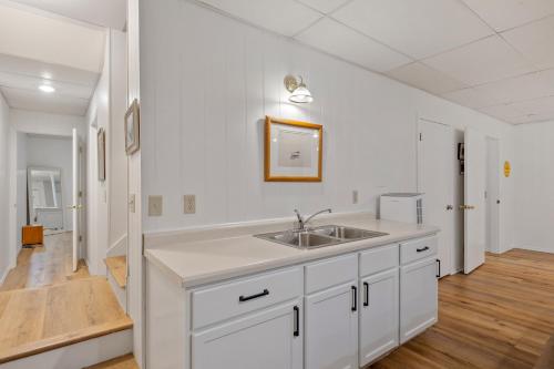 a kitchen with a sink and a white counter top at Friends&fam2min Towngame Roombikes10min Beach in Saugatuck