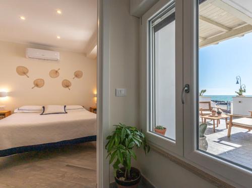 Ένα ή περισσότερα κρεβάτια σε δωμάτιο στο CASA MIRA luxury sea house fco airport