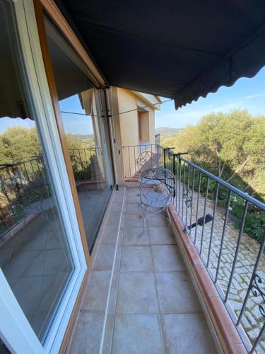 a balcony with a bench and a view at Venti di Vacanza - Levante & Grecale in Olbia
