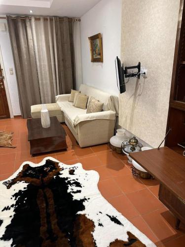a living room with a couch and a table at Harmony Platanidia Pelion in Platanidia