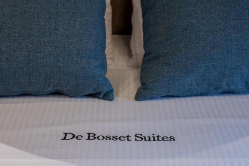 a close up of two pillows on a bed at De Bosset Suites Kefalonia in Argostoli