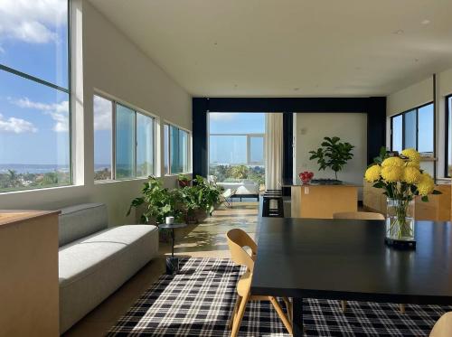 a living room with a table and a couch at Abpopa Hillcrest in San Diego