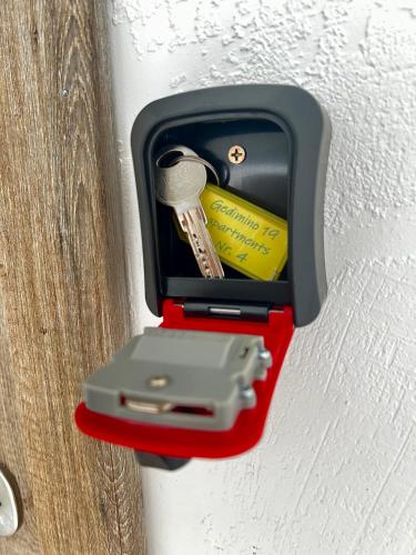 a box with a key in it on a wall at Gedimino 19 apartments in the old town of Ukmergė in Ukmergė