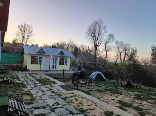 a small house with a tent and a campsite at THE HIDEAWAY Homestay Chail in Chail