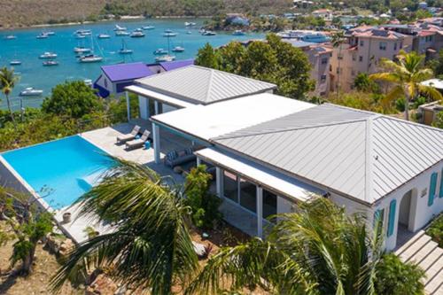 an aerial view of a house with a swimming pool at Tropical Panorama in Cruz Bay