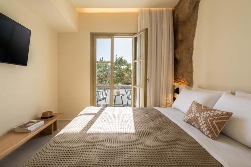 Postel nebo postele na pokoji v ubytování Philosophy of Mykonos Boutique Hotel