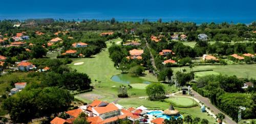 an aerial view of a resort with a golf course at Comfy Spacious Villa W- Pool, Jacuzzi, Bbq in Juan Dolio