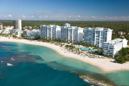 an aerial view of a resort on a beach at Comfy Spacious Villa W- Pool, Jacuzzi, Bbq in Juan Dolio