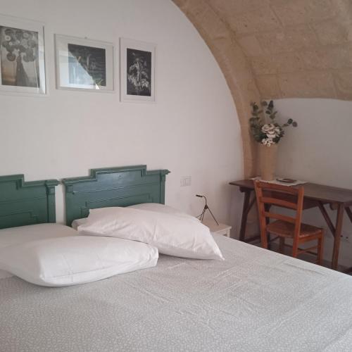 Ένα ή περισσότερα κρεβάτια σε δωμάτιο στο IL Borgo Antico b&b