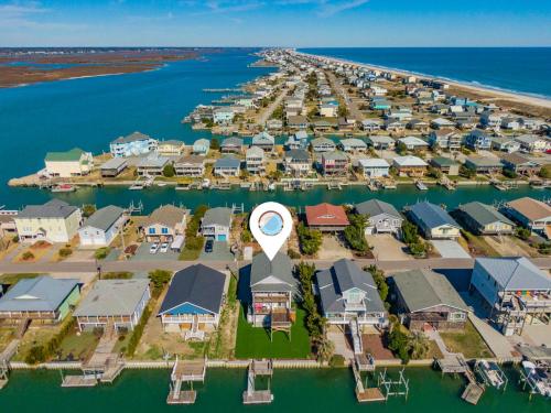 an aerial view of a marina with houses at Sunset Nonsense in Topsail Beach