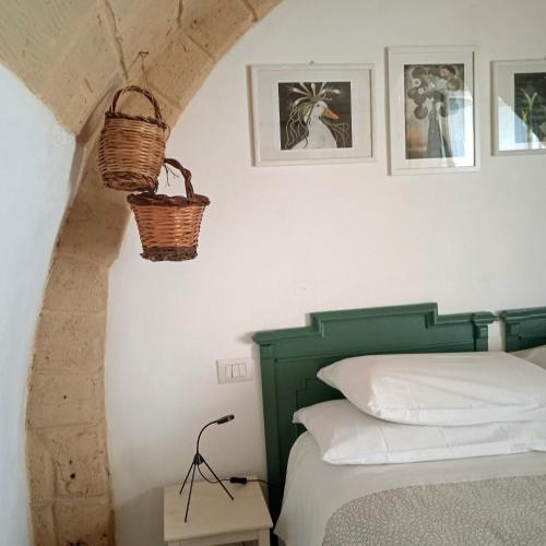Ένα ή περισσότερα κρεβάτια σε δωμάτιο στο IL Borgo Antico b&b