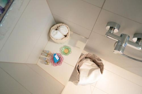 a corner of a bathroom with a sink and a towel at Villa Dida Hvar in Hvar