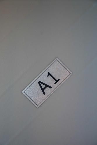 a sign on the top of a ceiling with the word karma at Finikas Suites & Apartments Airport By Airstay in Artemida