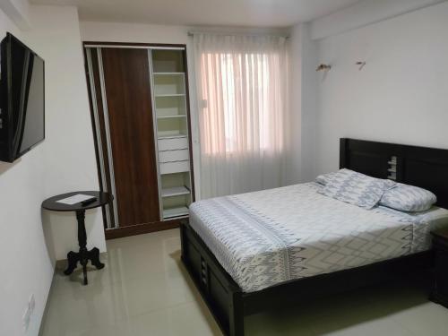 Ένα ή περισσότερα κρεβάτια σε δωμάτιο στο Apartamento en el Centro