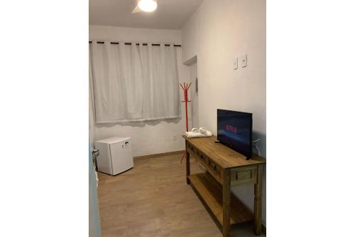 TV a/nebo společenská místnost v ubytování Edificio Barros - Suítes Exclusivas