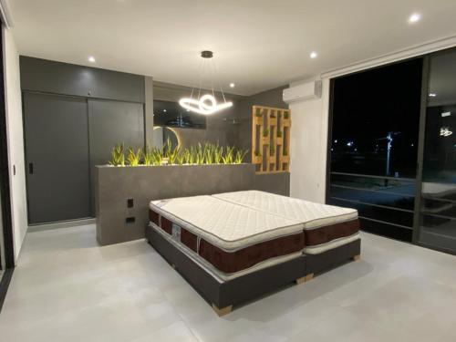 Giường trong phòng chung tại Casa Vacacional Cerca de Ibagué