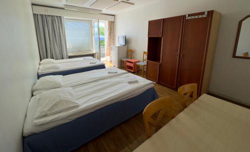 Postel nebo postele na pokoji v ubytování B&B Retro - Guesthouse Kupittaa