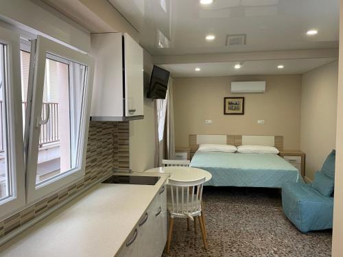 En eller flere senge i et værelse på Aparthotel Pelicano