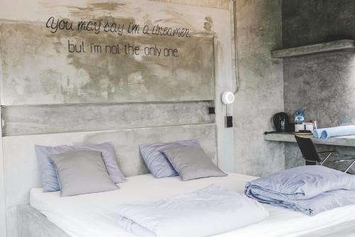 Postel nebo postele na pokoji v ubytování Patoey House