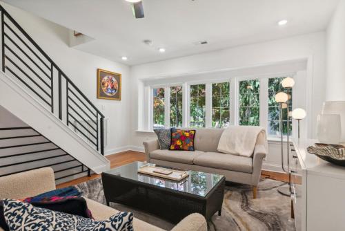 a living room with a couch and a table at Family Friendly in the Heart of Mt Airy in Philadelphia