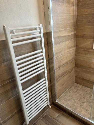 a shower with a glass door in a bathroom at Lugano 41 by ALEhotels in Rimini