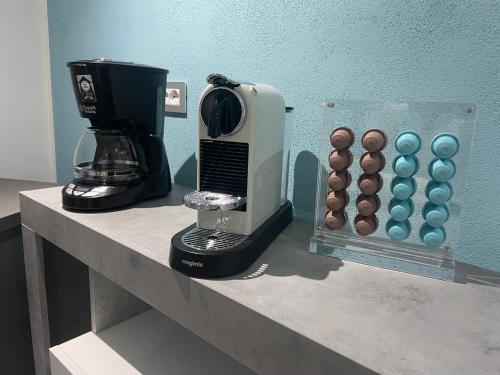 a coffee maker sitting on a counter with a bunch of eggs at La Maison del Mas Suite in Elmas