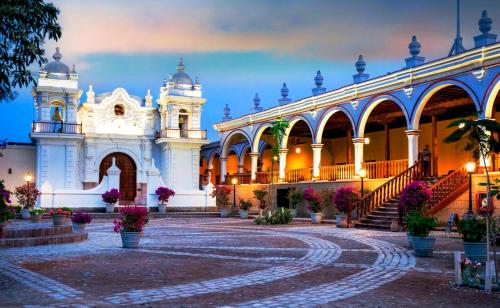 a building with a staircase in front of it at Casa Hacienda San Jose in Chincha Alta