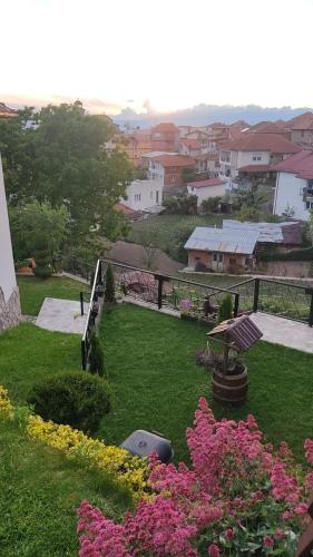 a view of a yard with flowers and a park at Guest House Stevovski in Ohrid