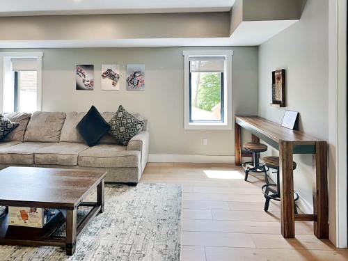 a living room with a couch and a table at Heavenly Summit in McHenry