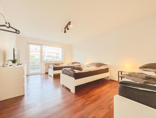 Ένα ή περισσότερα κρεβάτια σε δωμάτιο στο Home4Now BM02 Monteursunterkunft in Bergheim I 2 Schlafzimmer für 5 Personen I Küche I SmartTV I WiFi I Parkplatz