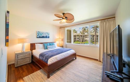 a bedroom with a bed and a window at Stunning Luxurious Ocean Villa with Ocean Views From All bedrooms. in Kahuku