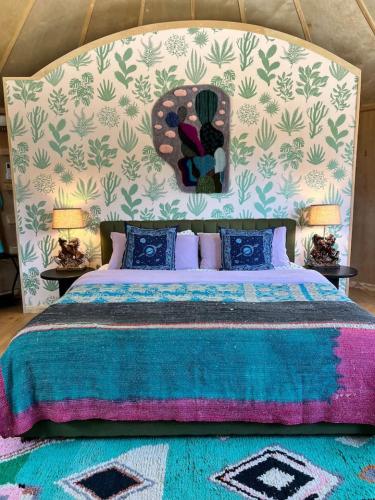 a bedroom with a large bed with a head board at Silo House "Opal" in Austin