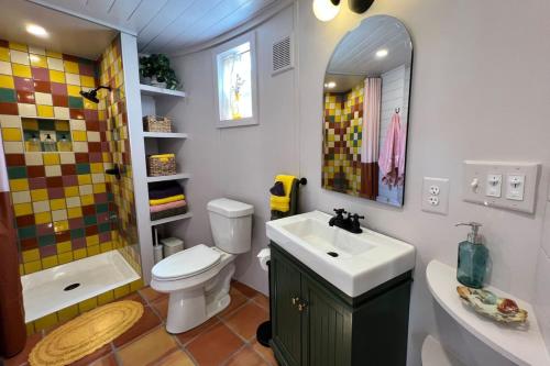 a bathroom with a sink and a toilet and a shower at Silo House "Opal" in Austin