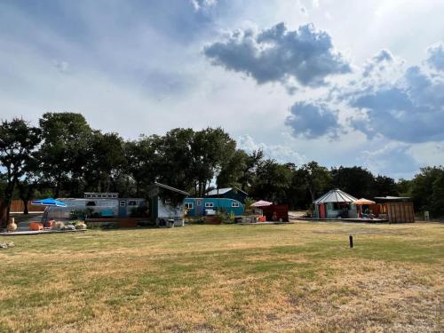 a group of camping huts in a field at Silo House "Opal" in Austin