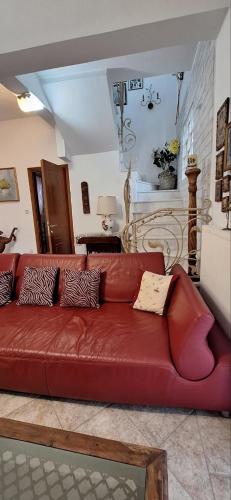 a brown leather couch in a living room at Eleochori View Sea in Elaiokhórion