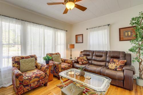 a living room with a leather couch and chairs at Main Street Home 1 Mile to Callaway Gardens in Pine Mountain